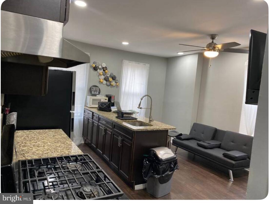 a kitchen with a stove and a refrigerator