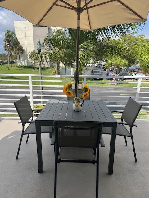 a view of an outdoor sitting area with furniture