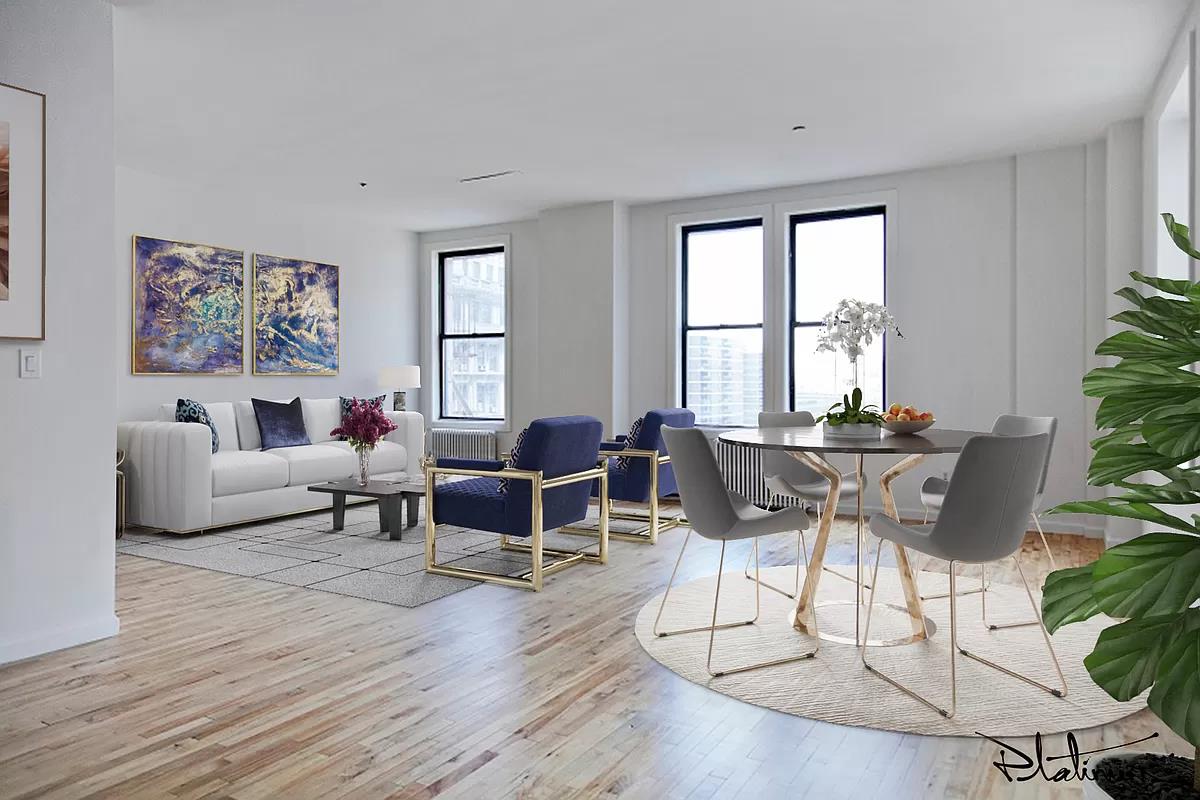 a living room with furniture a potted plant and a large window