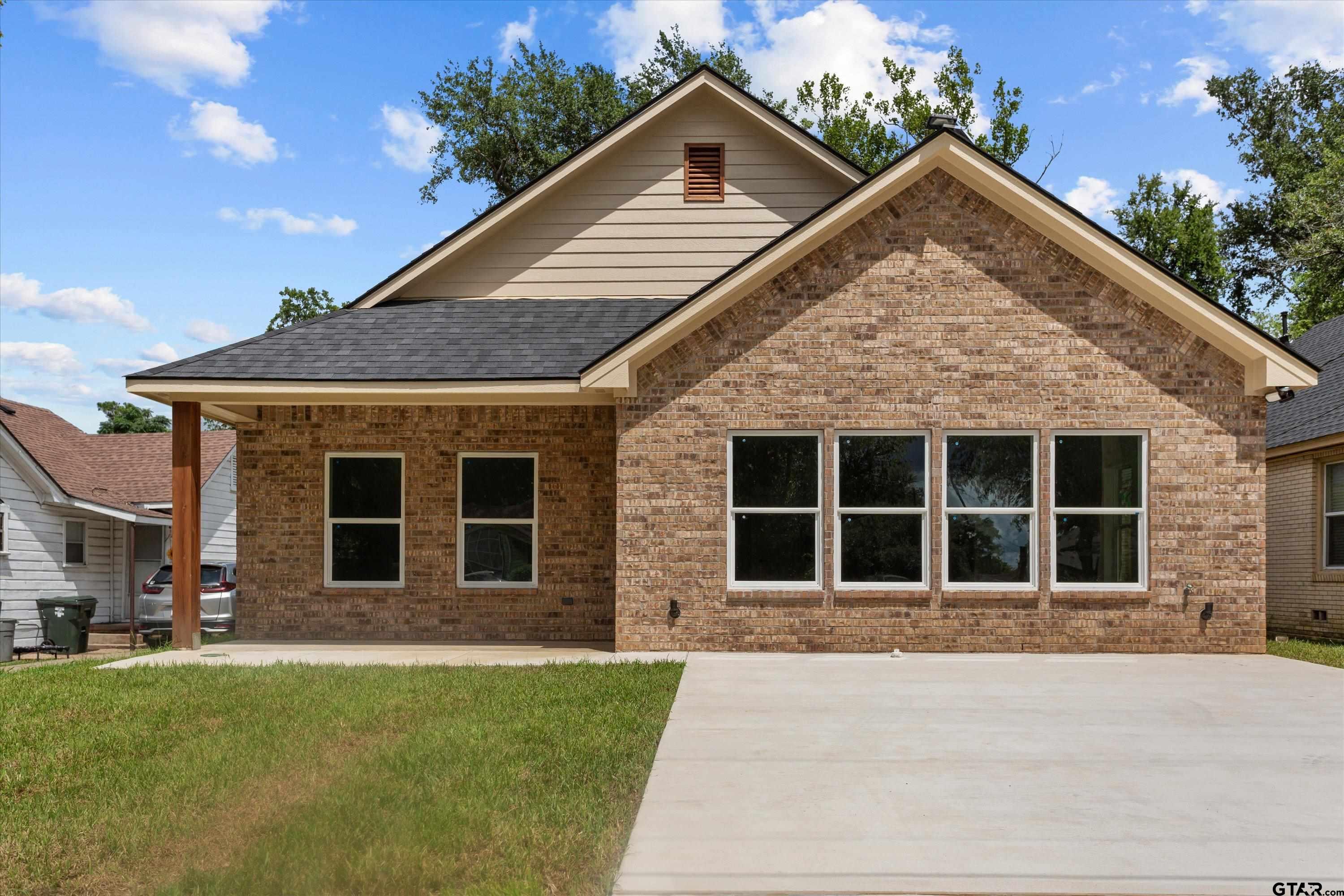 front view of a house with a yard