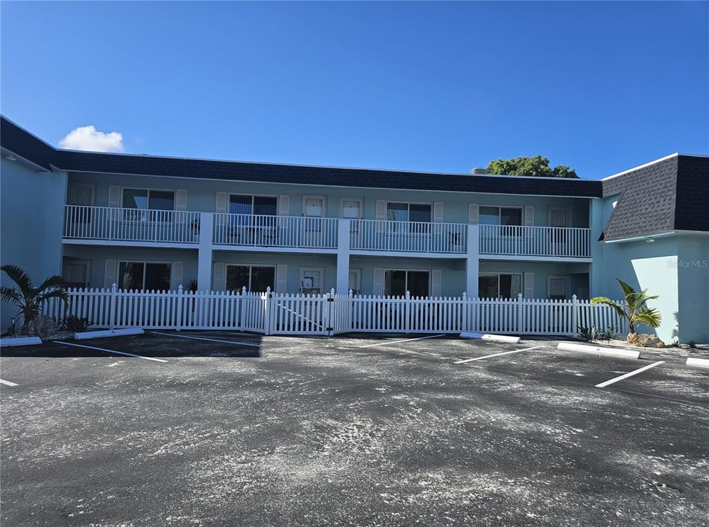 a front view of a building with a yard