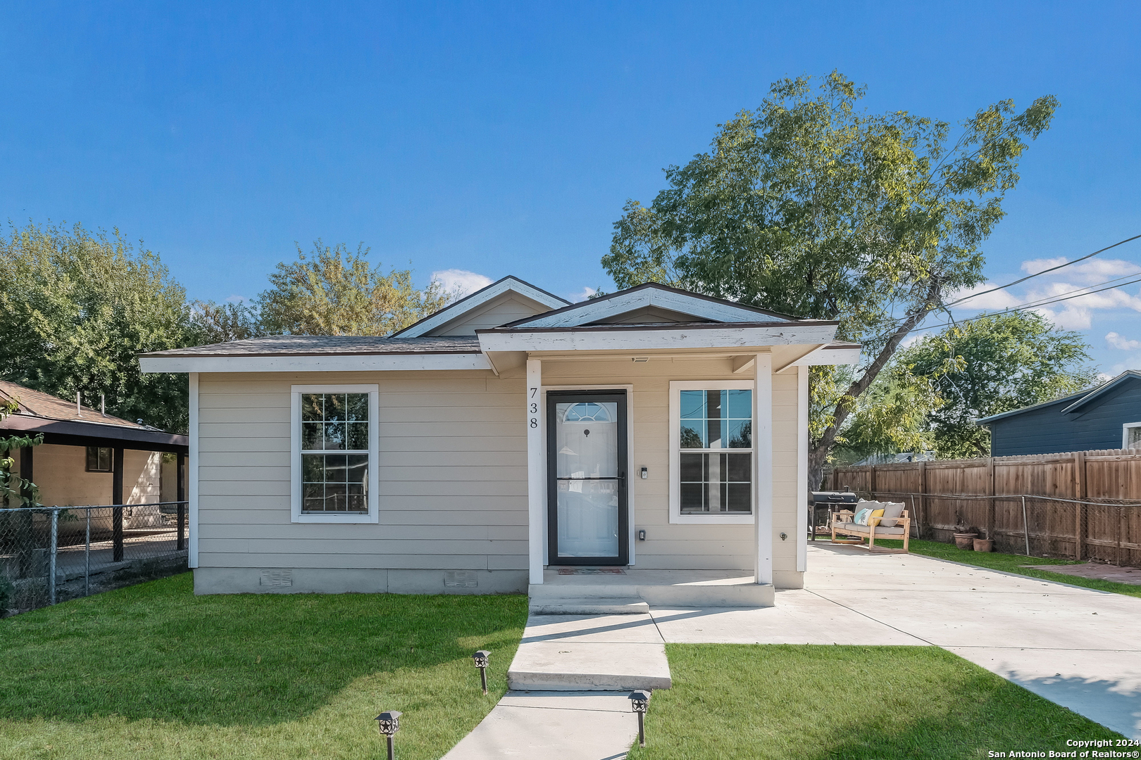 a front view of a house with a yard