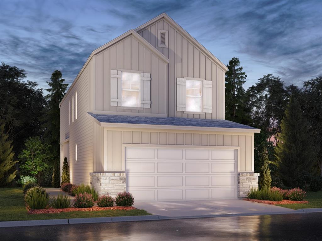 a front view of a house with garage