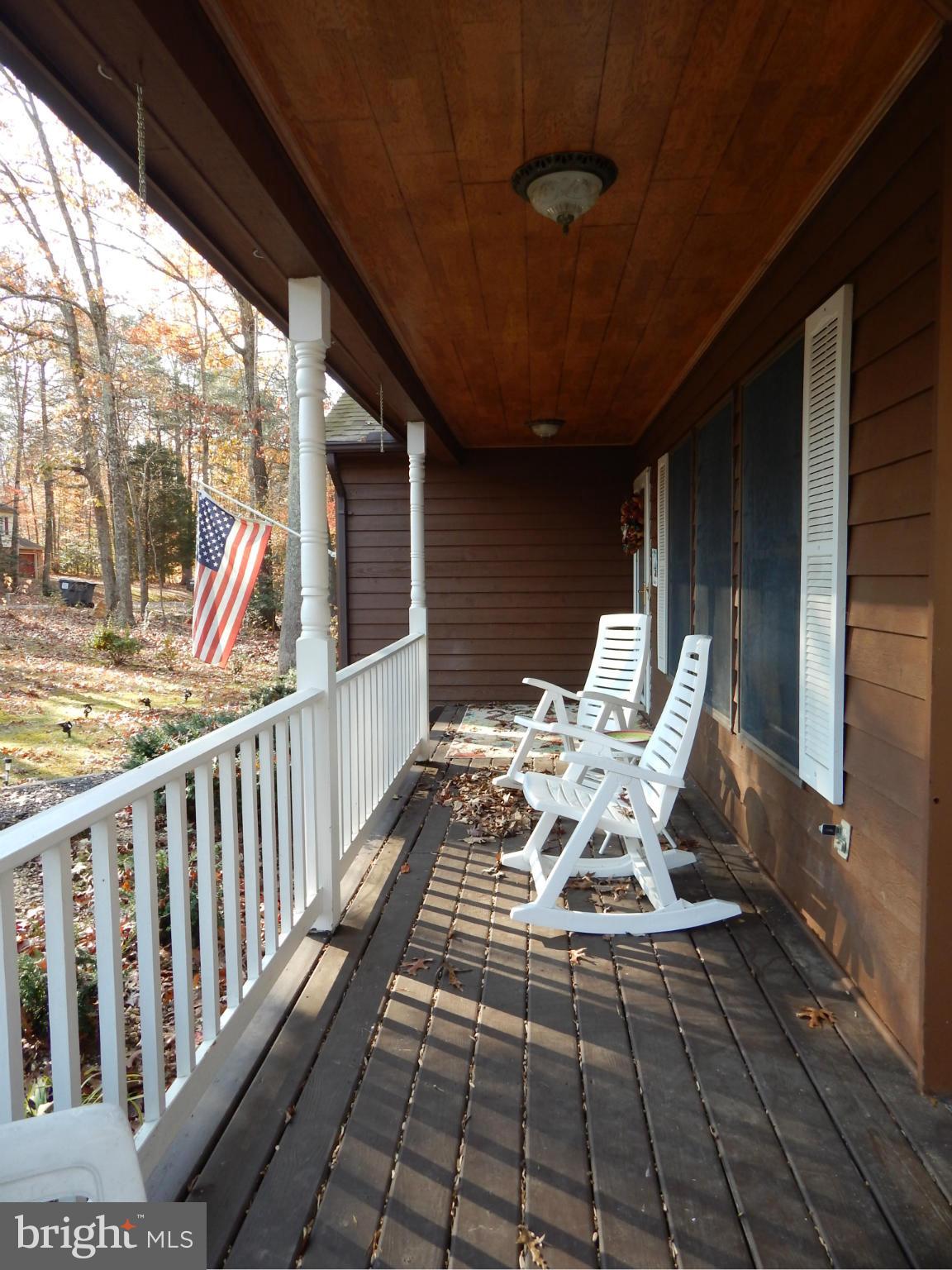 a view of balcony with furniture