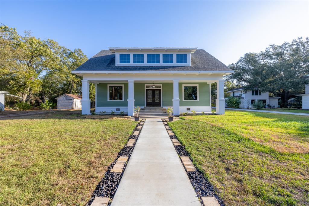 a view of house with swimming pool outdoor seating