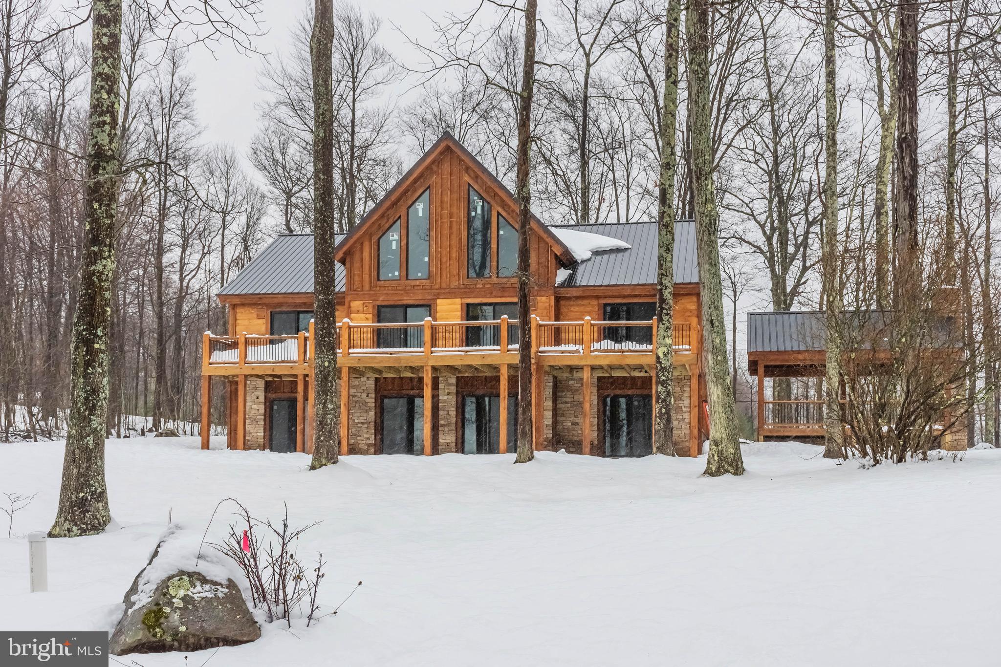 a front view of a house with a snow