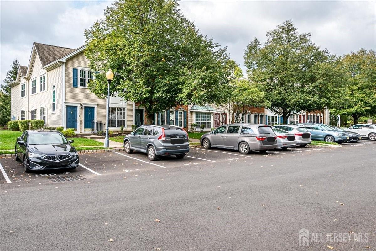 a view of a cars parked in front of a house