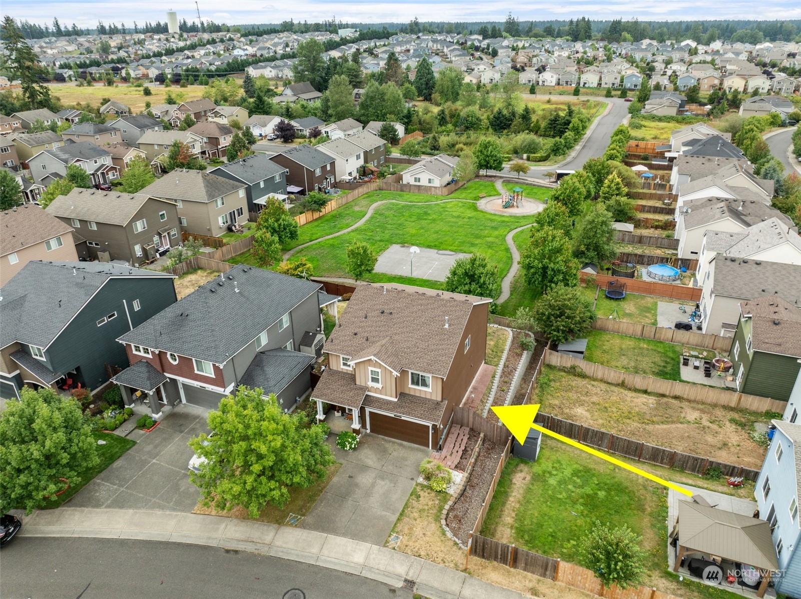 an aerial view of residential house with outdoor space and swimming pool