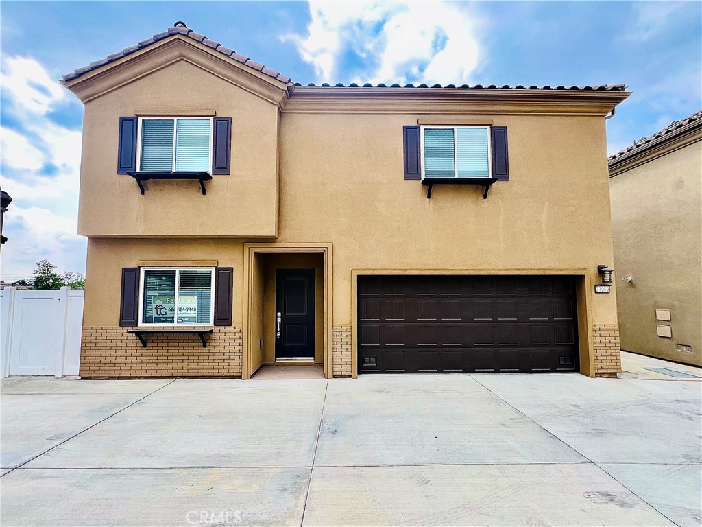 a front view of a house with a garage