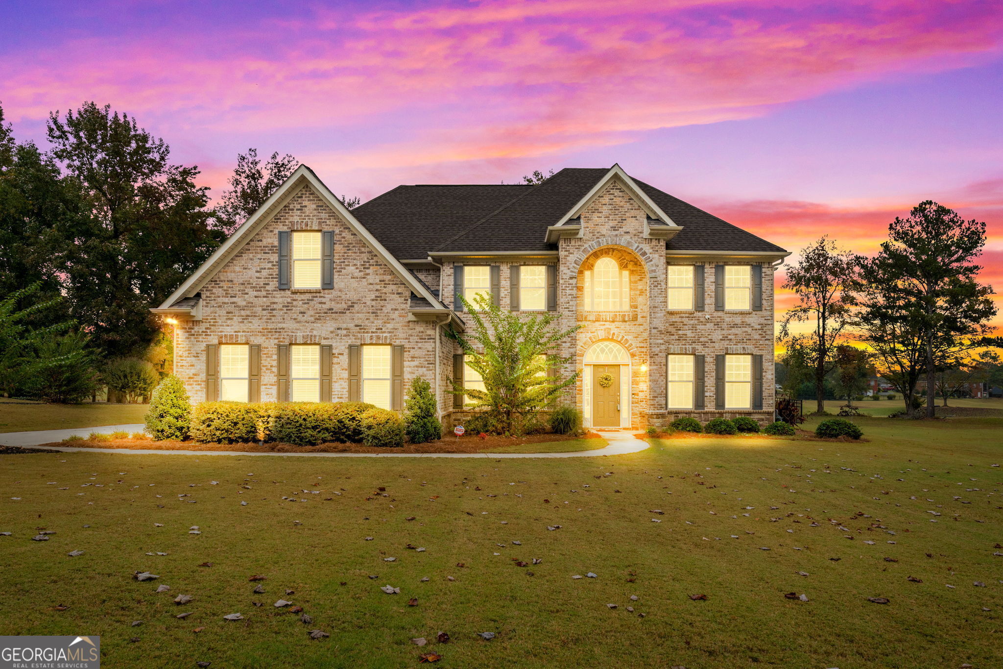 a front view of a house with a yard