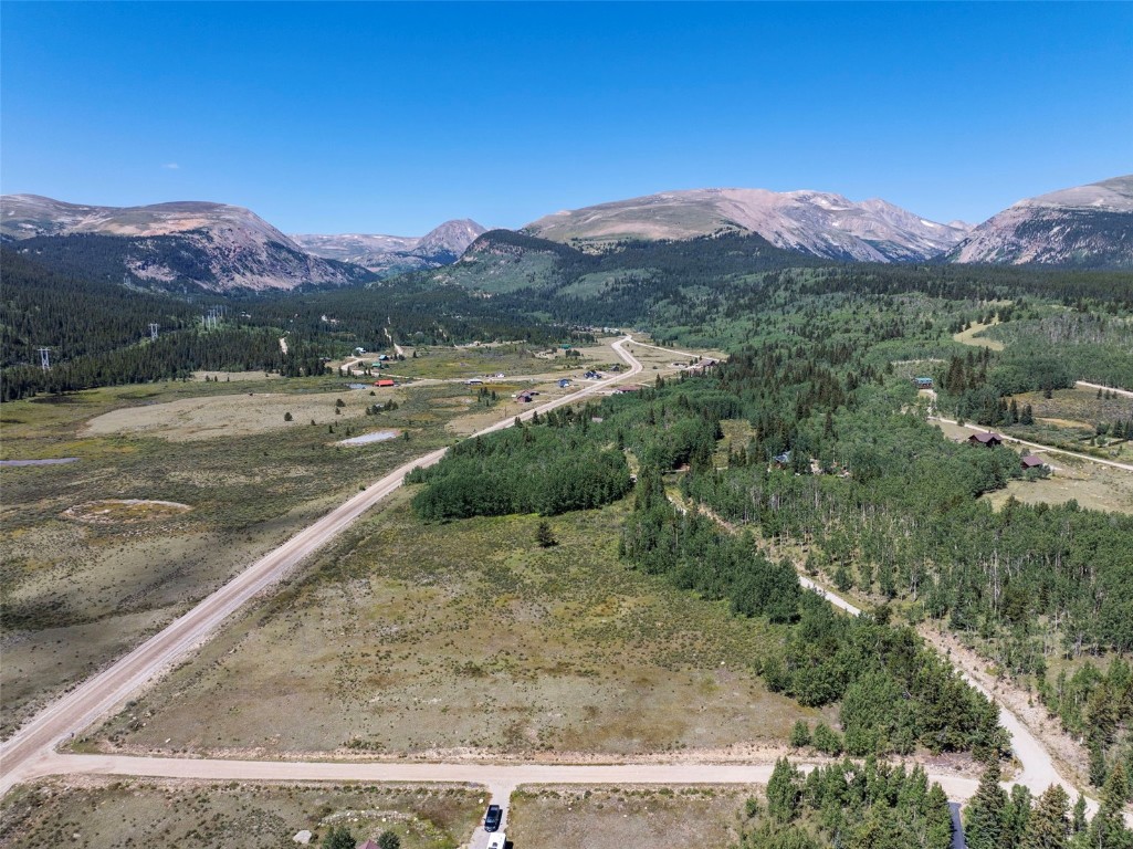 a view of a mountain with a yard