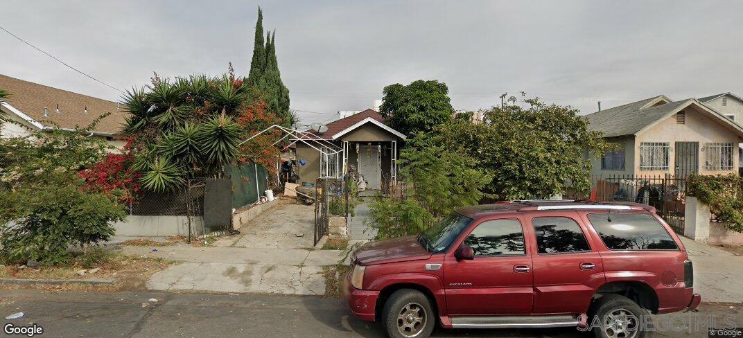 a view of a car parked in front of a house