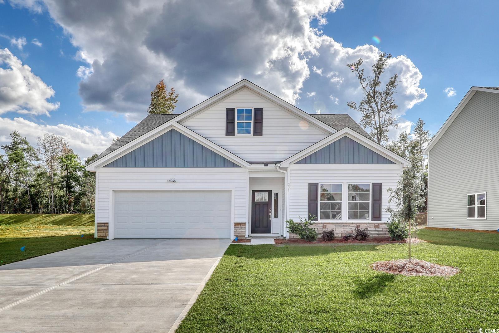 View of front of home featuring a front lawn