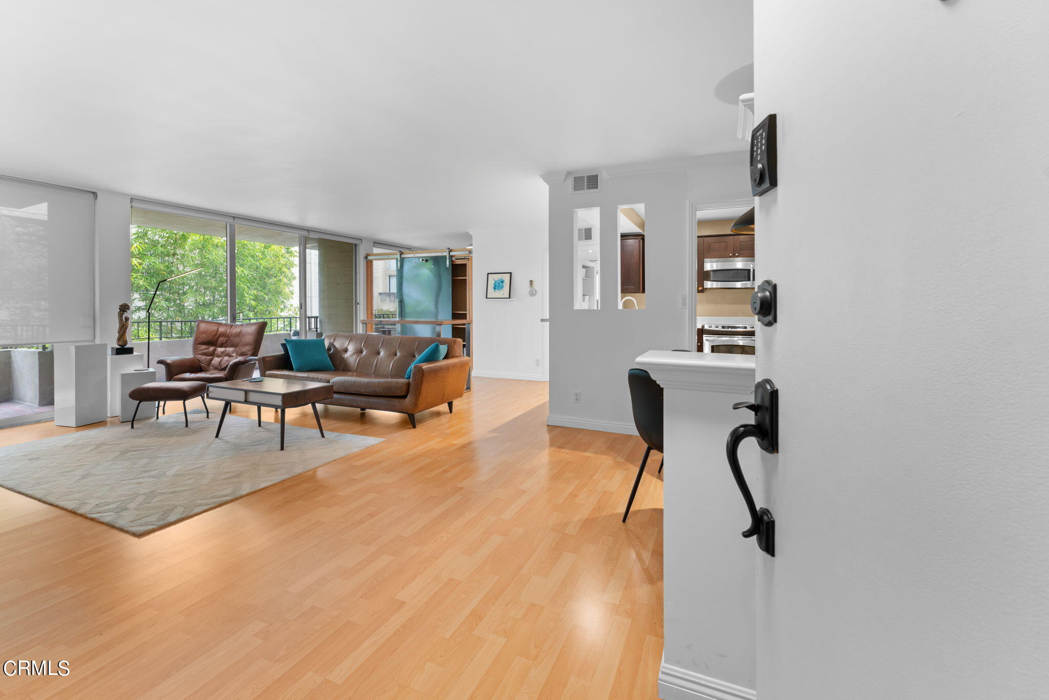 a living room with furniture and a large window