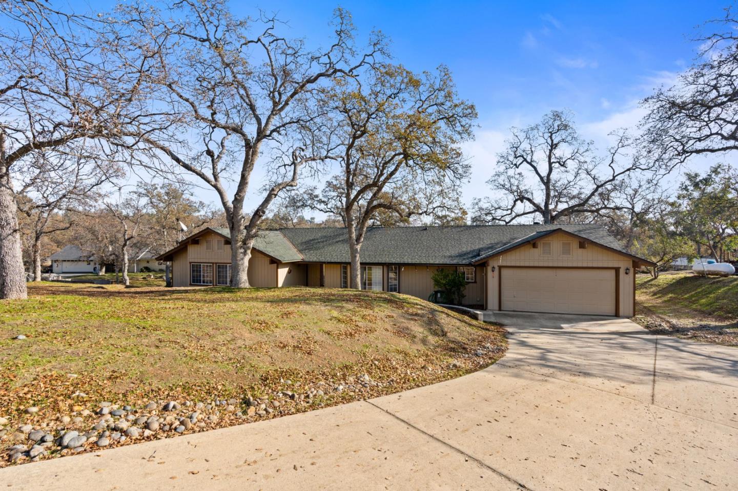 a front view of house with yard covered in front of house