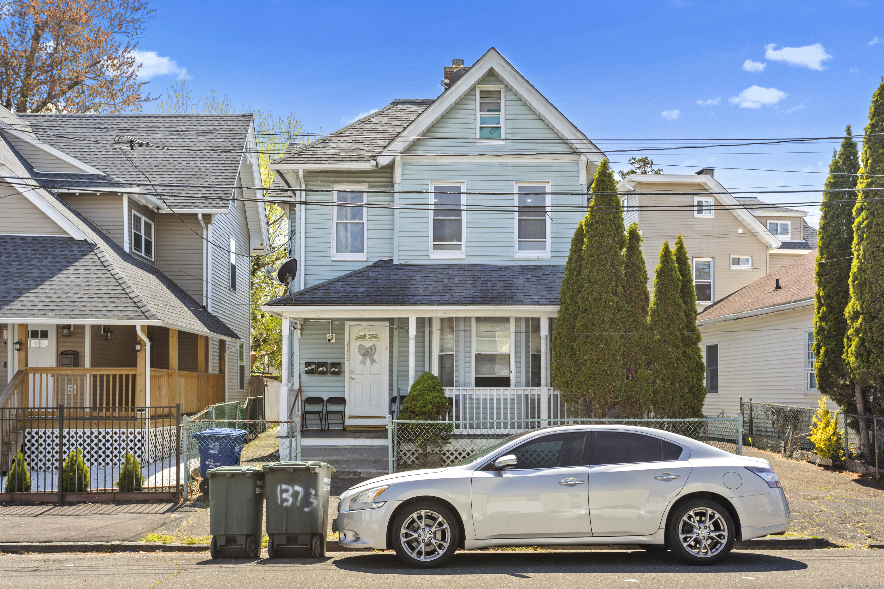 a front view of a house with parking space