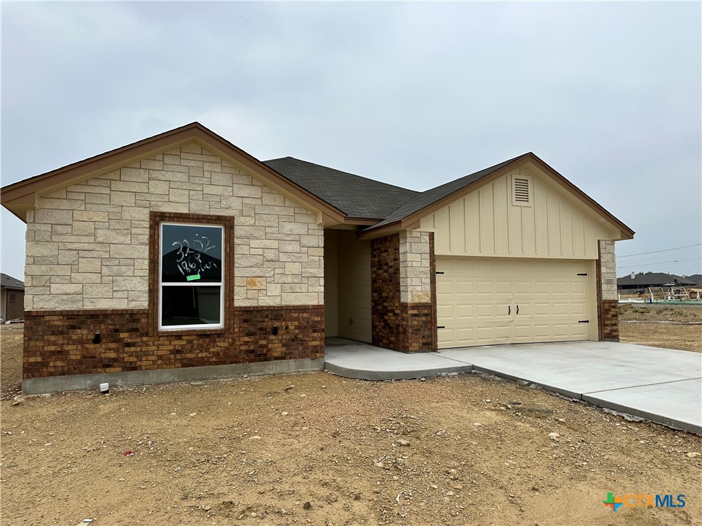 a front view of a house with a garage