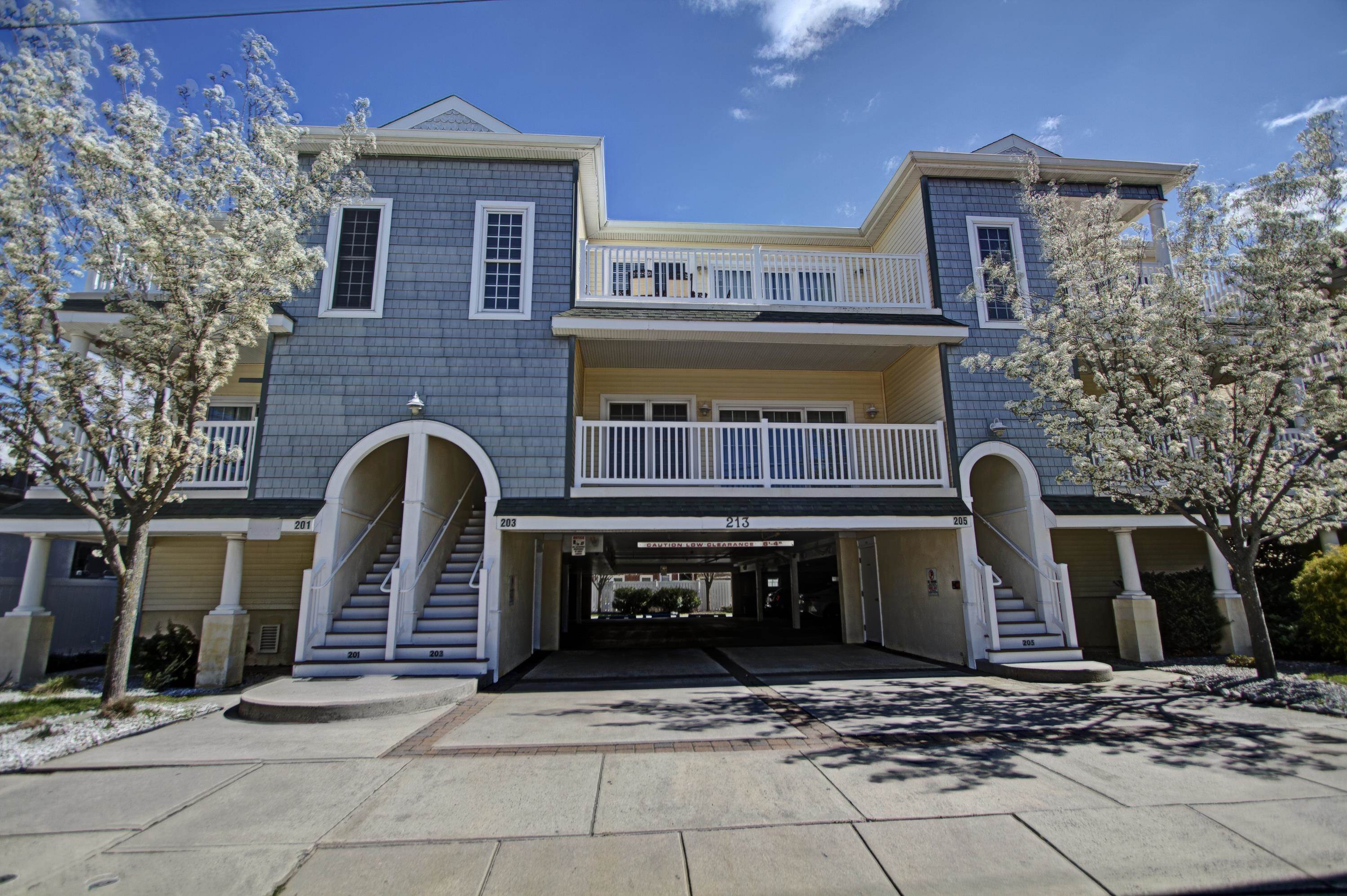 a front view of a house with parking space