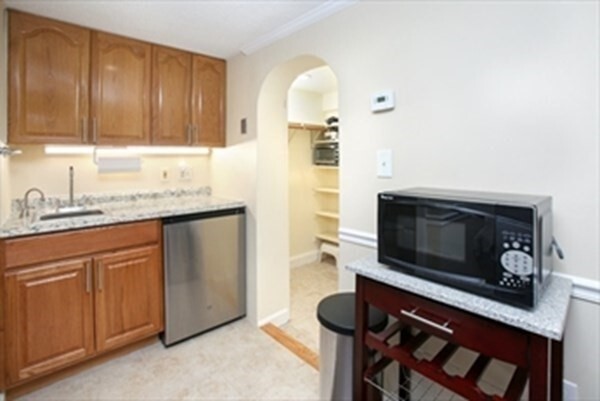 a kitchen with a stove and a microwave