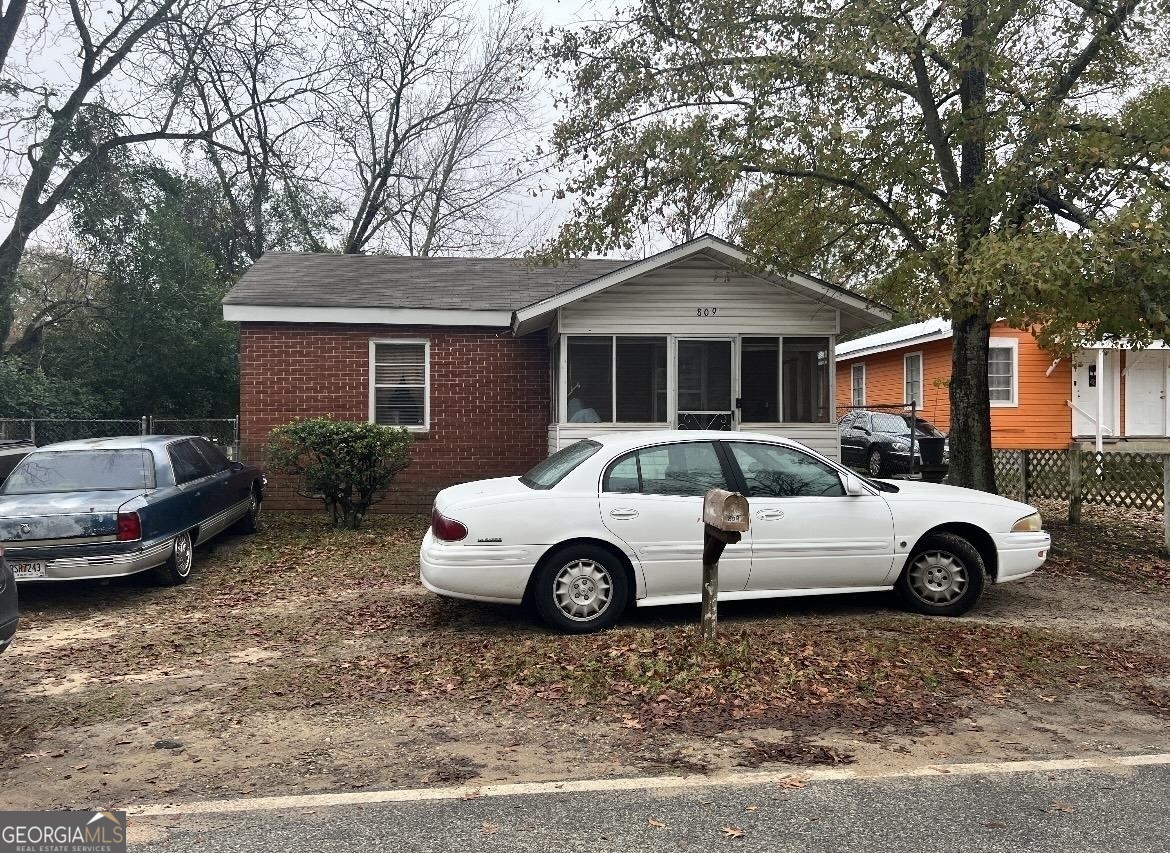 a car parked in front of a house