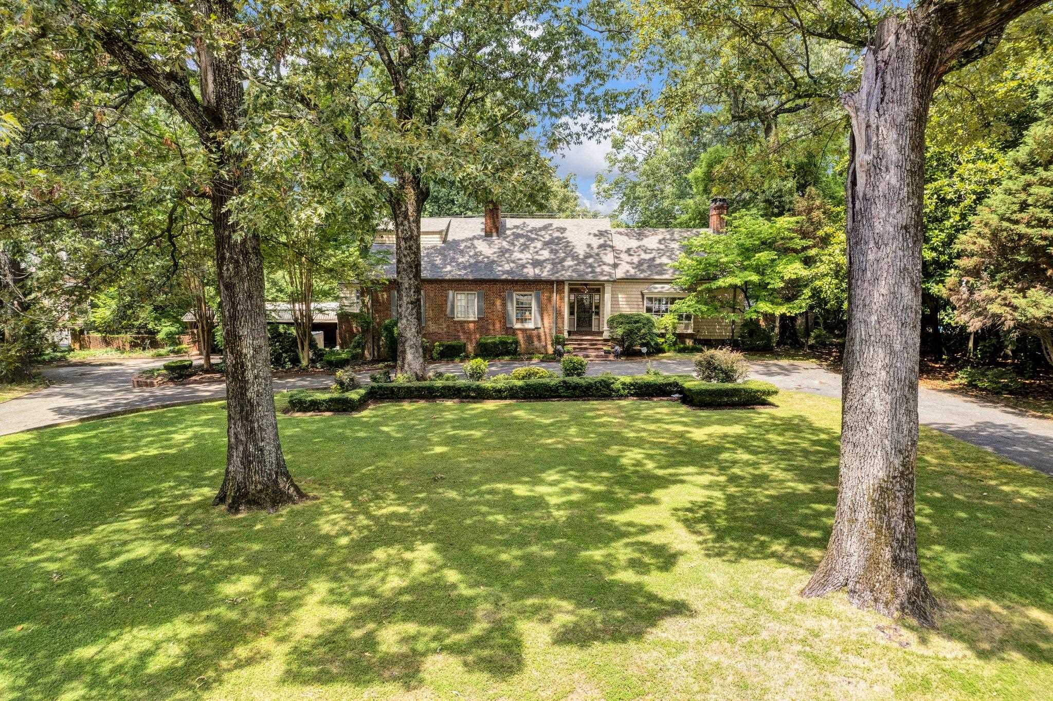 a front view of a house with a yard table and chairs