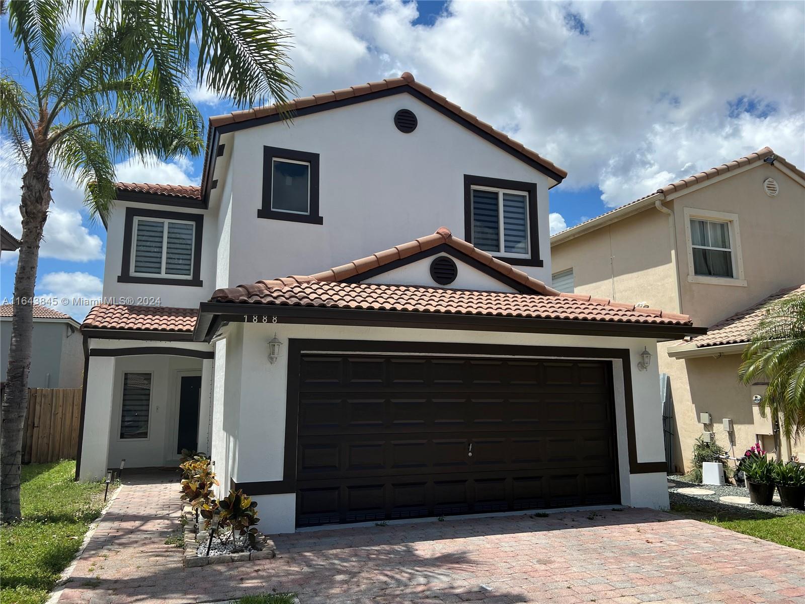 a front view of a house with a garage