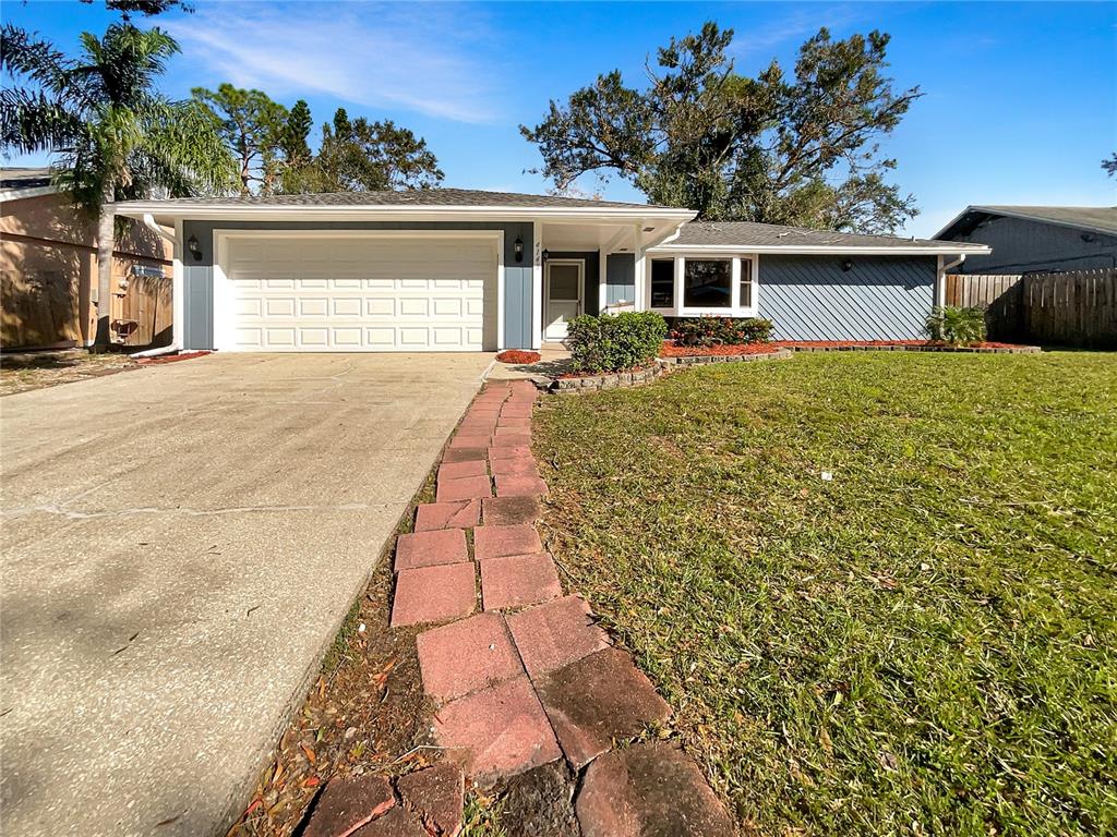 front view of a house with a yard