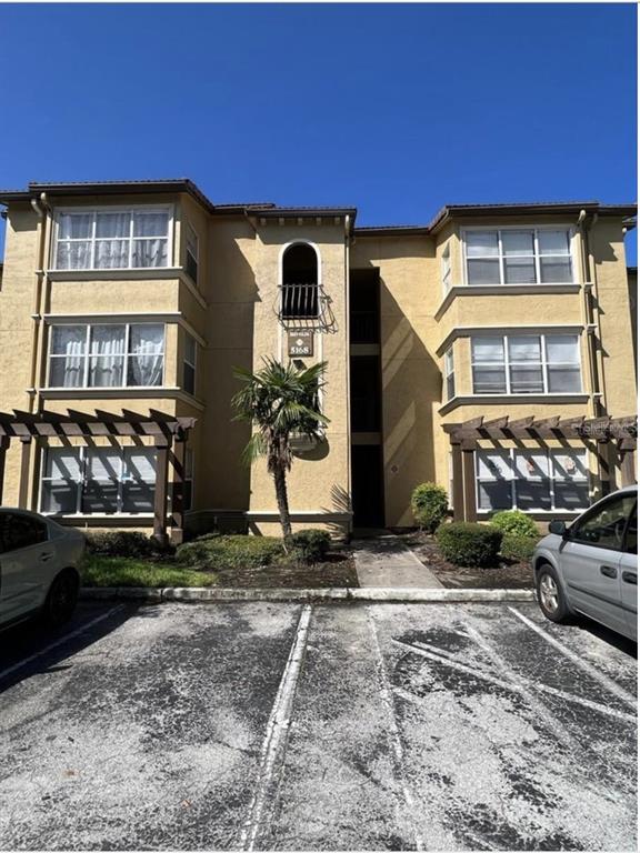 a front view of a house with parking space