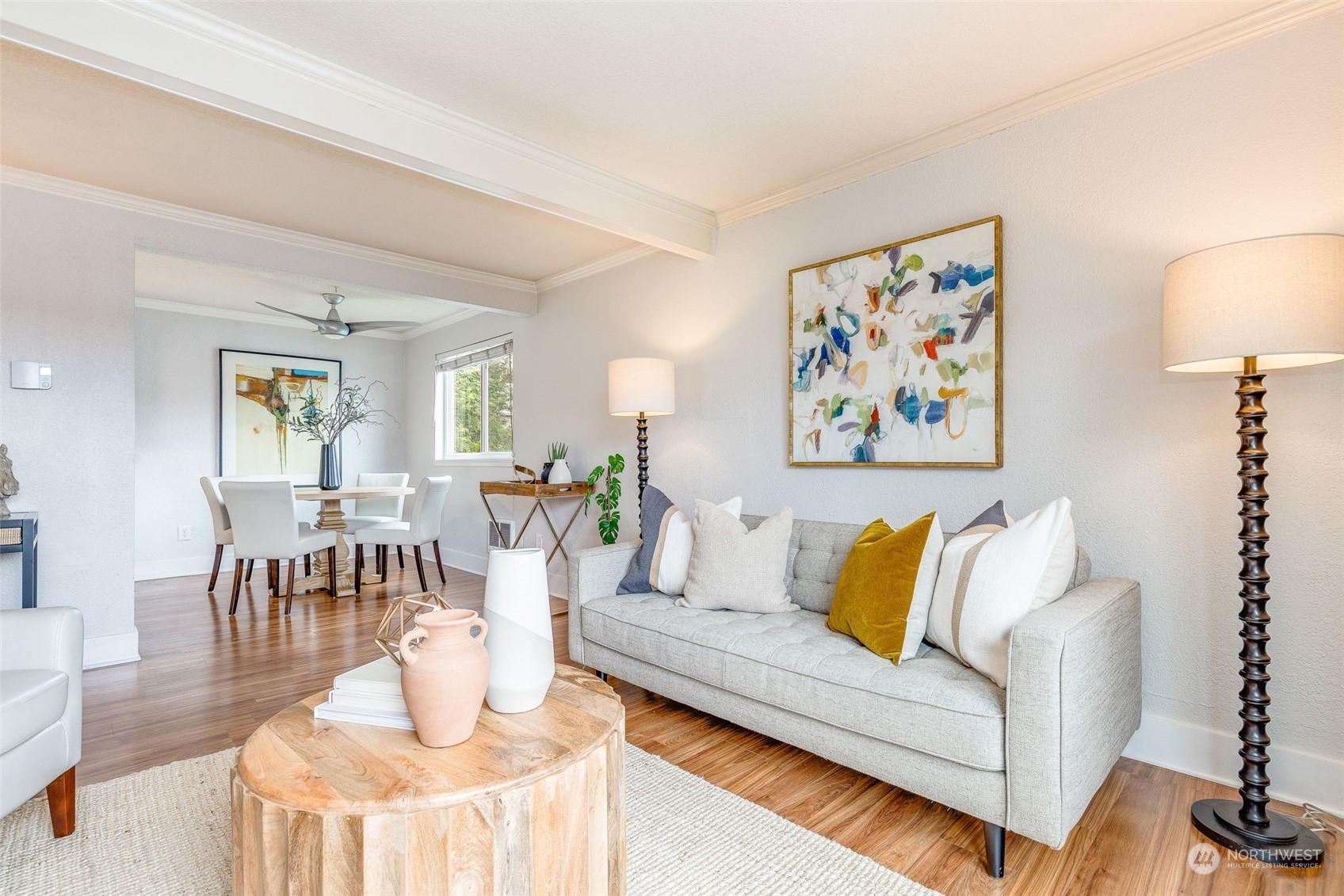 a living room with furniture and wooden floor