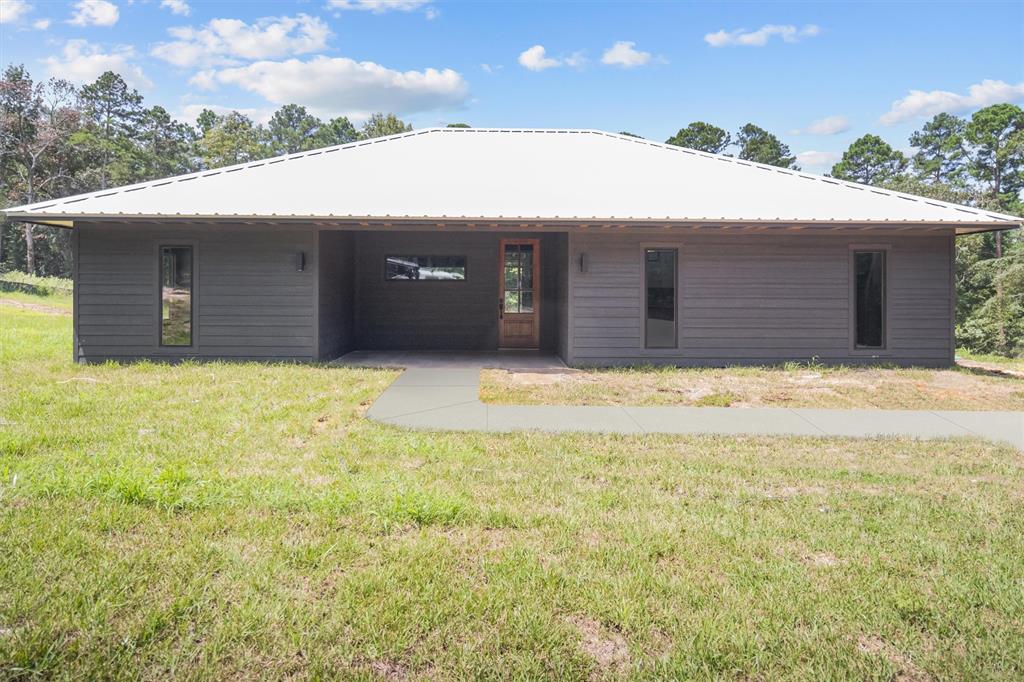 a house with yard in front of it