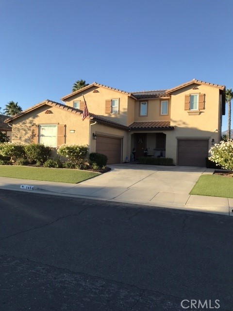 a view of house with yard