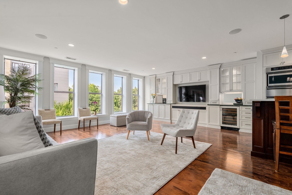 a living room with fireplace furniture and a flat screen tv