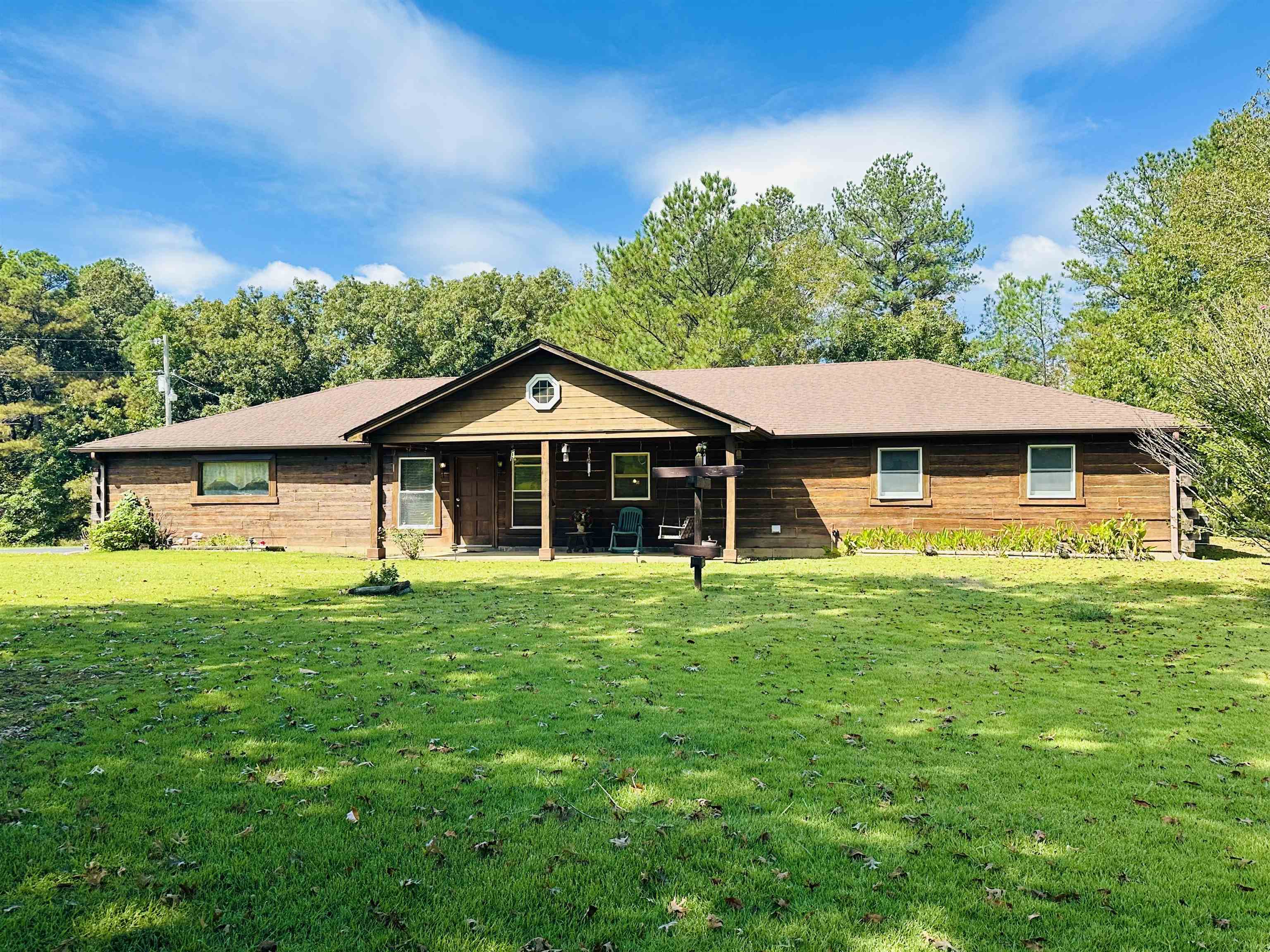 Ranch-style home with a patio and a front yard