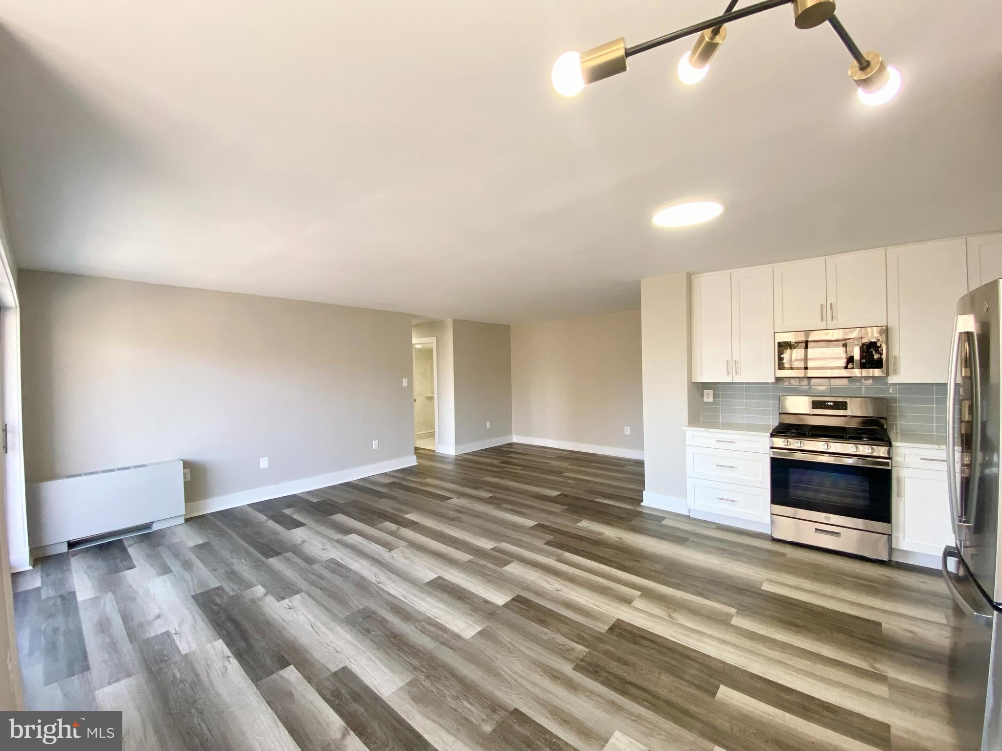 a view of kitchen and stainless steel appliances