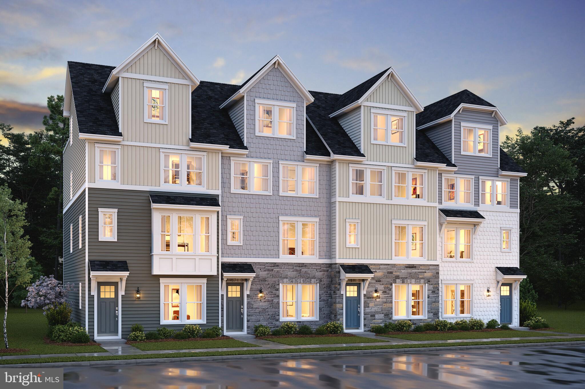 a front view of residential houses with street