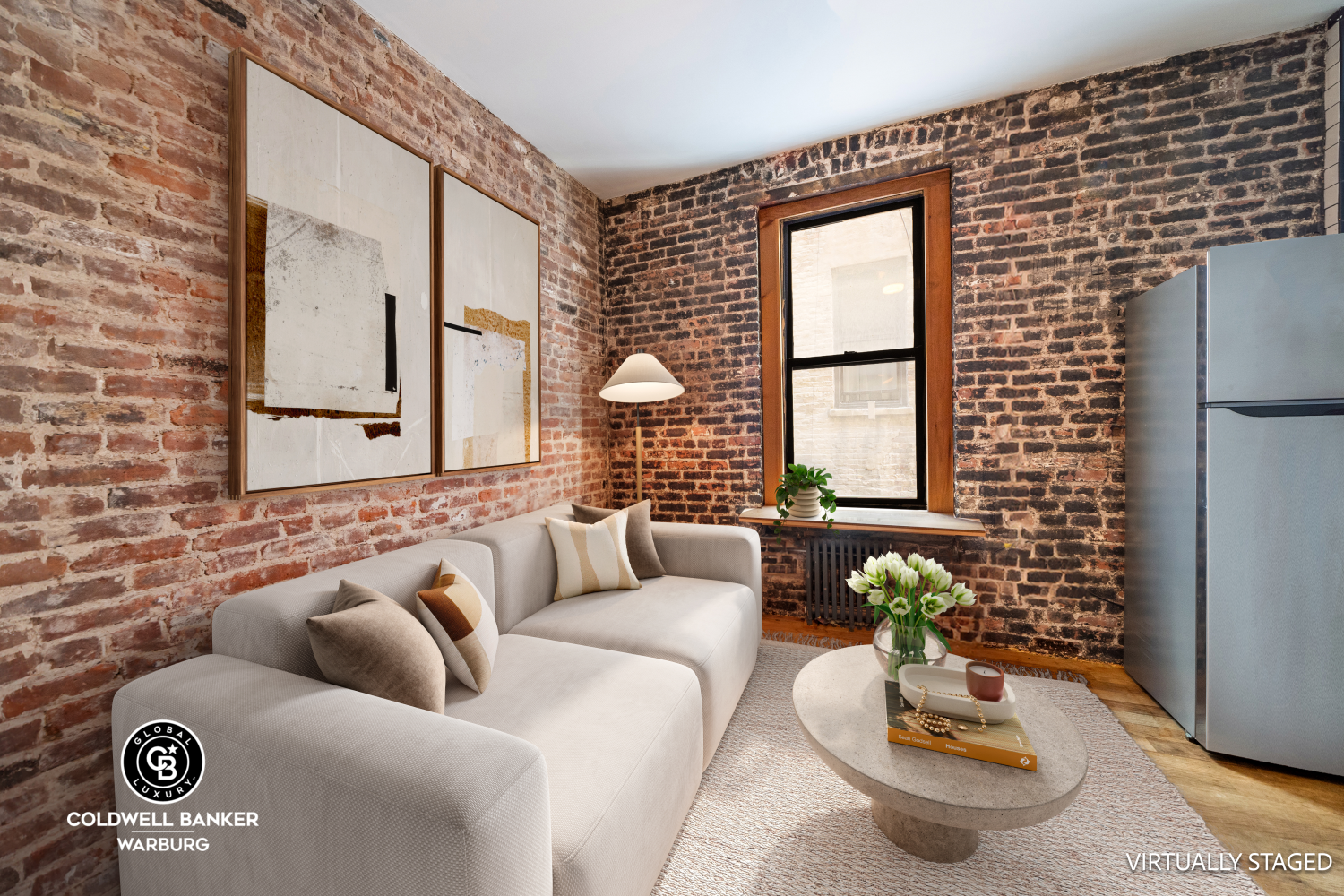 a living room with furniture and a potted plant