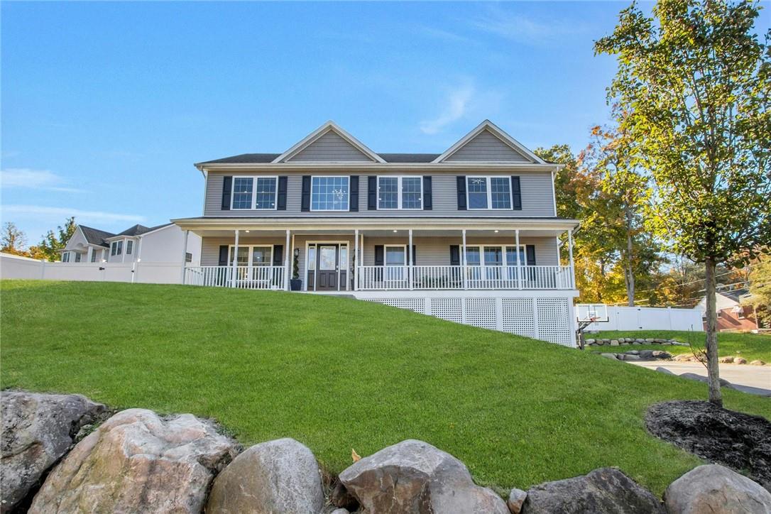 a front view of house with yard and green space