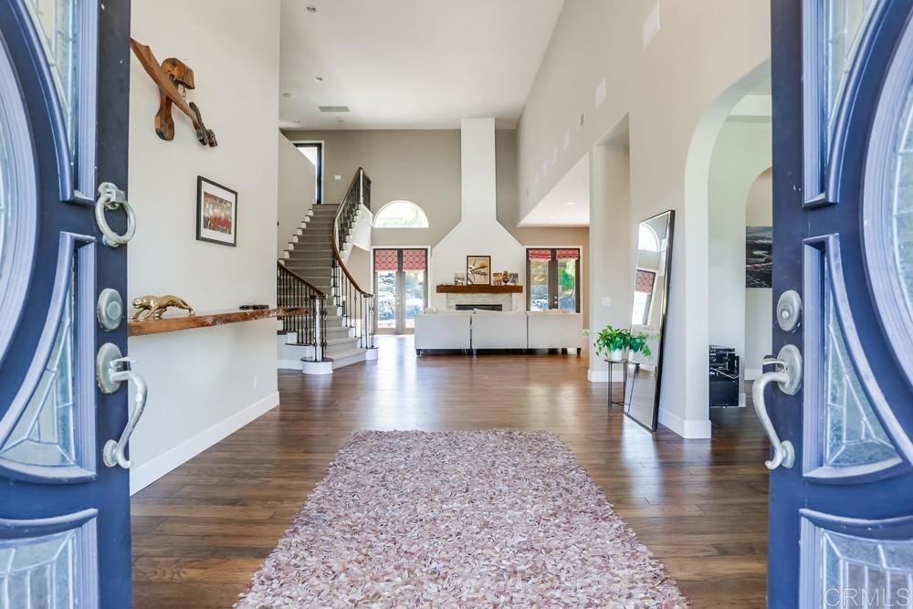 a view of living room kitchen and entryway