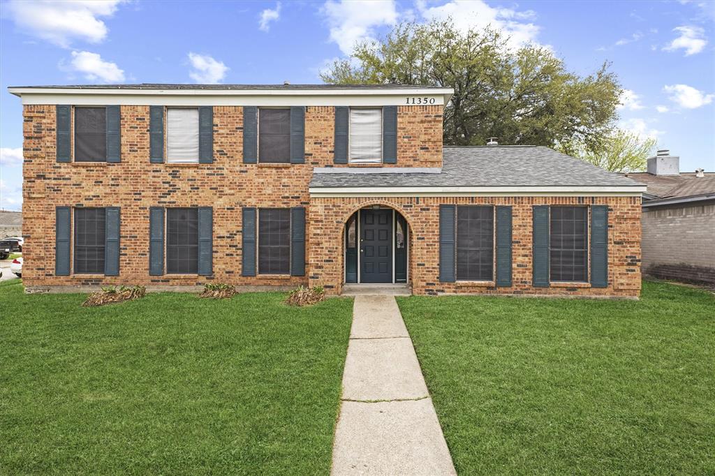 front view of a house with a yard