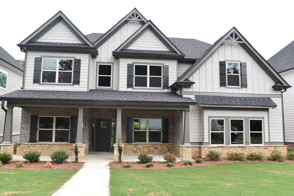 front view of a house with a yard