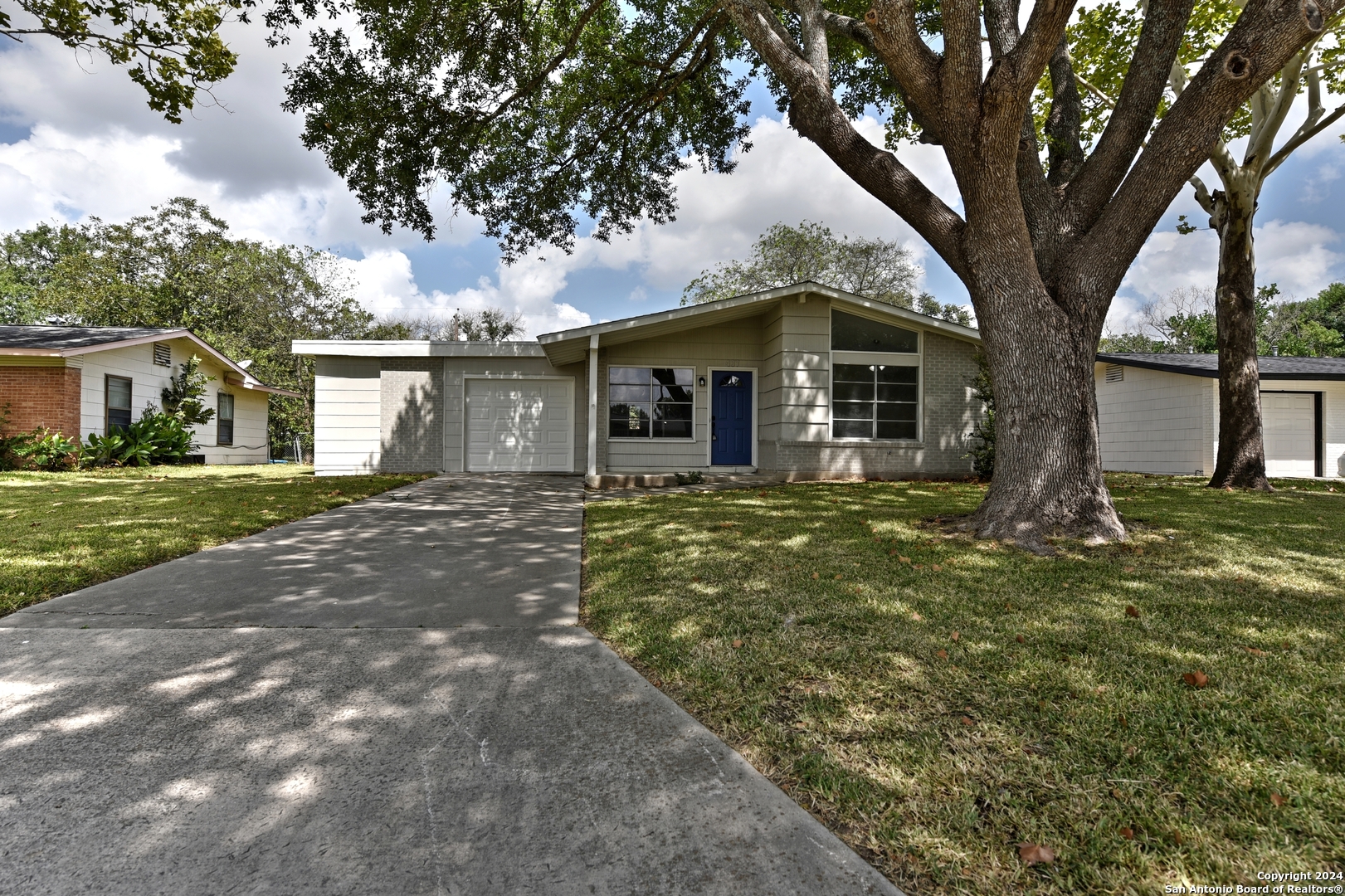 a front view of a house with a yard