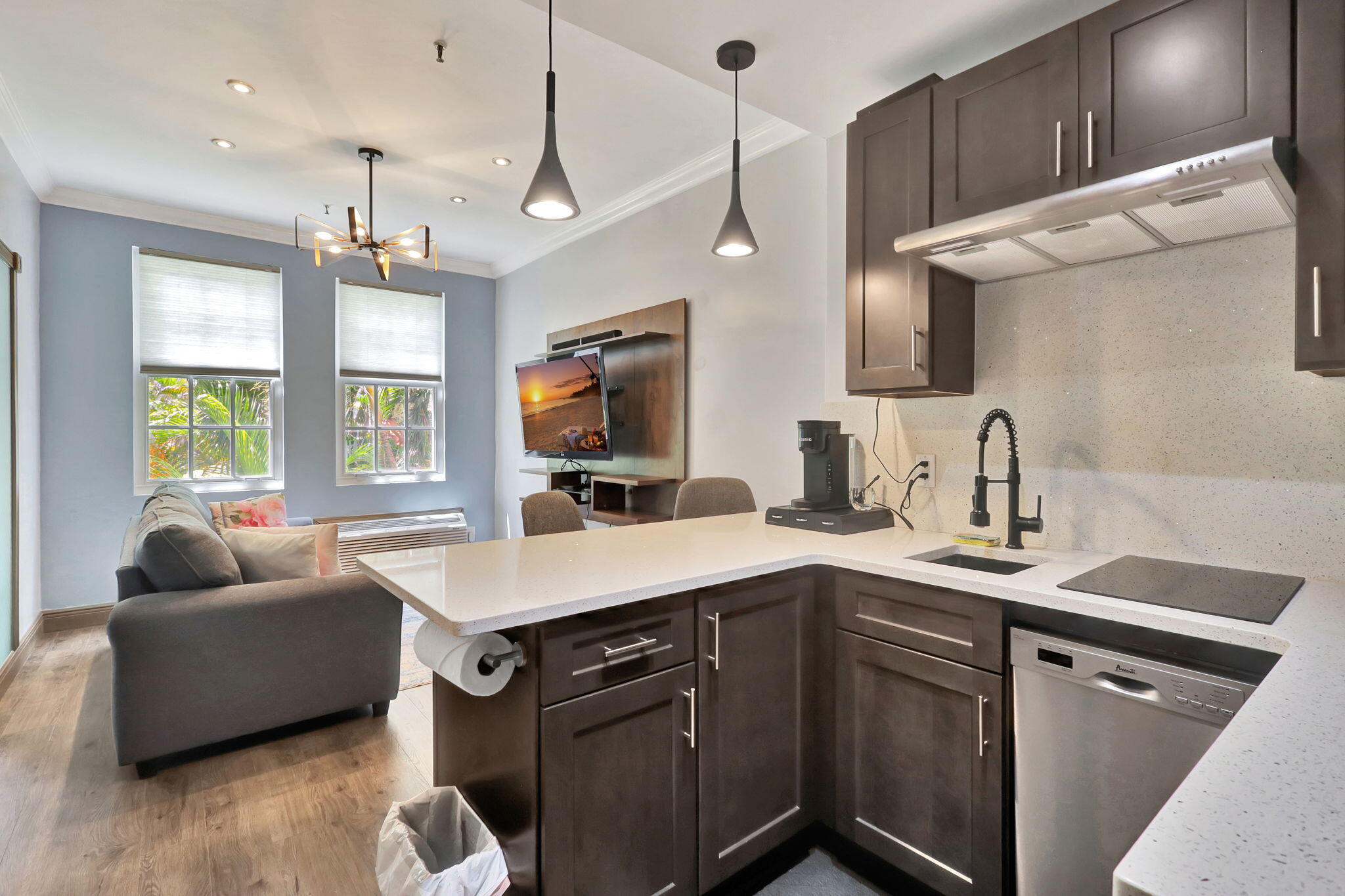 a kitchen with a sink appliances and a window