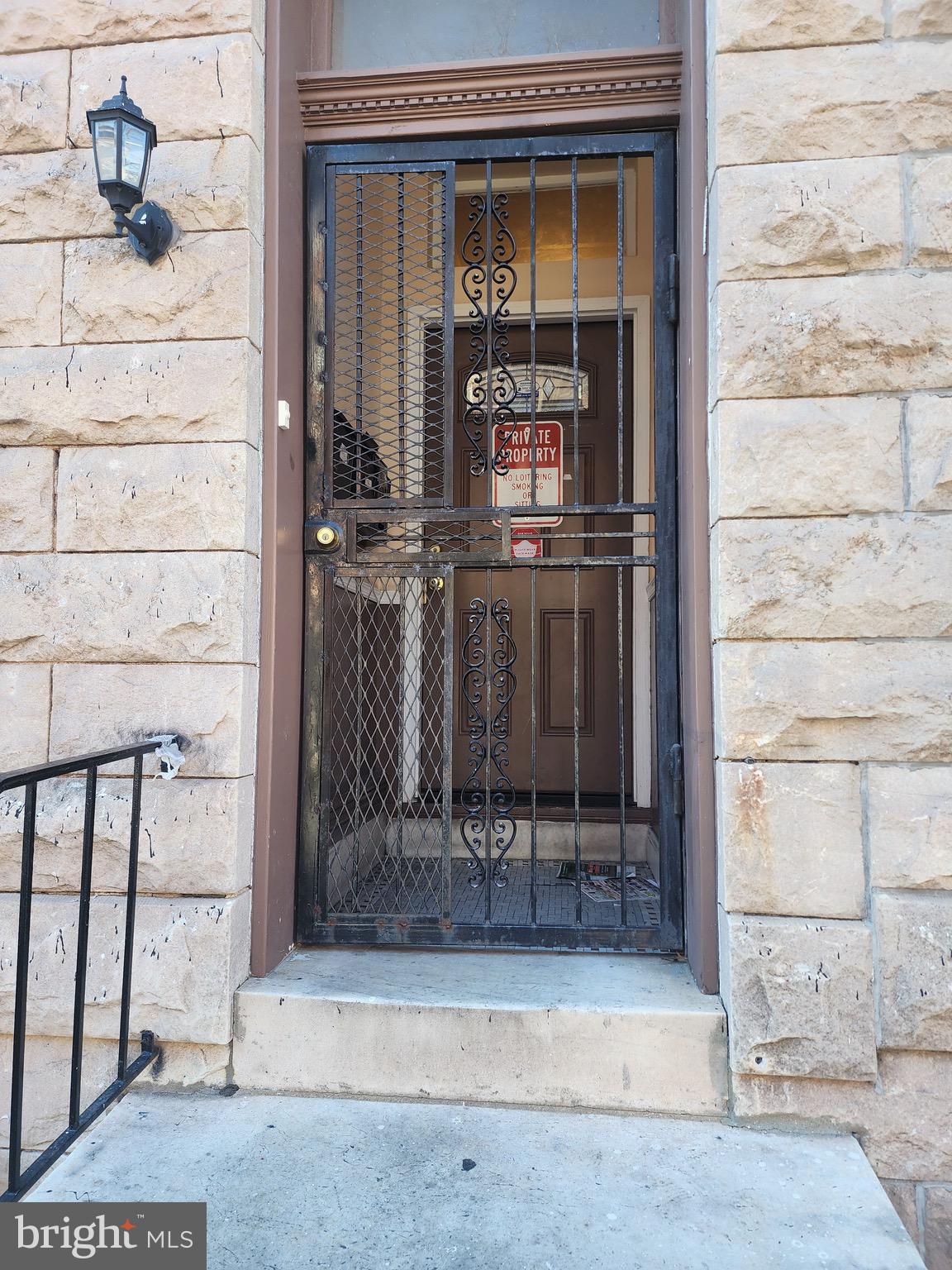 a view of front door of house and living room