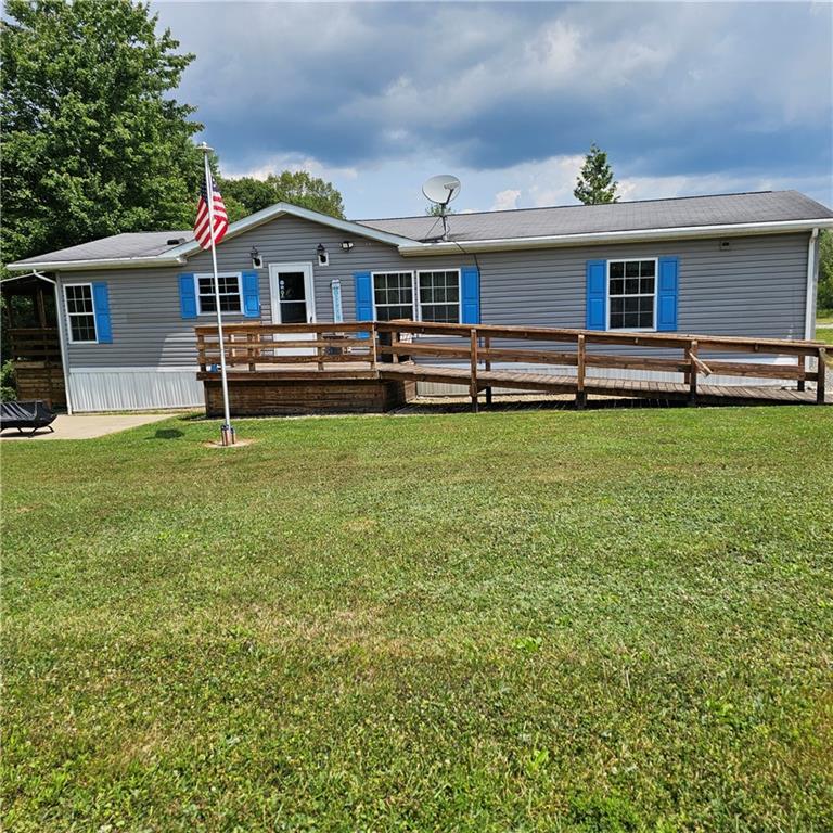 a front view of house with yard and seating area