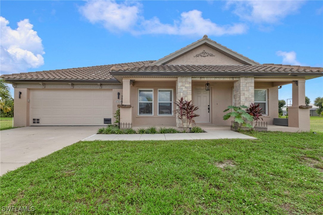 front view of a house with a yard