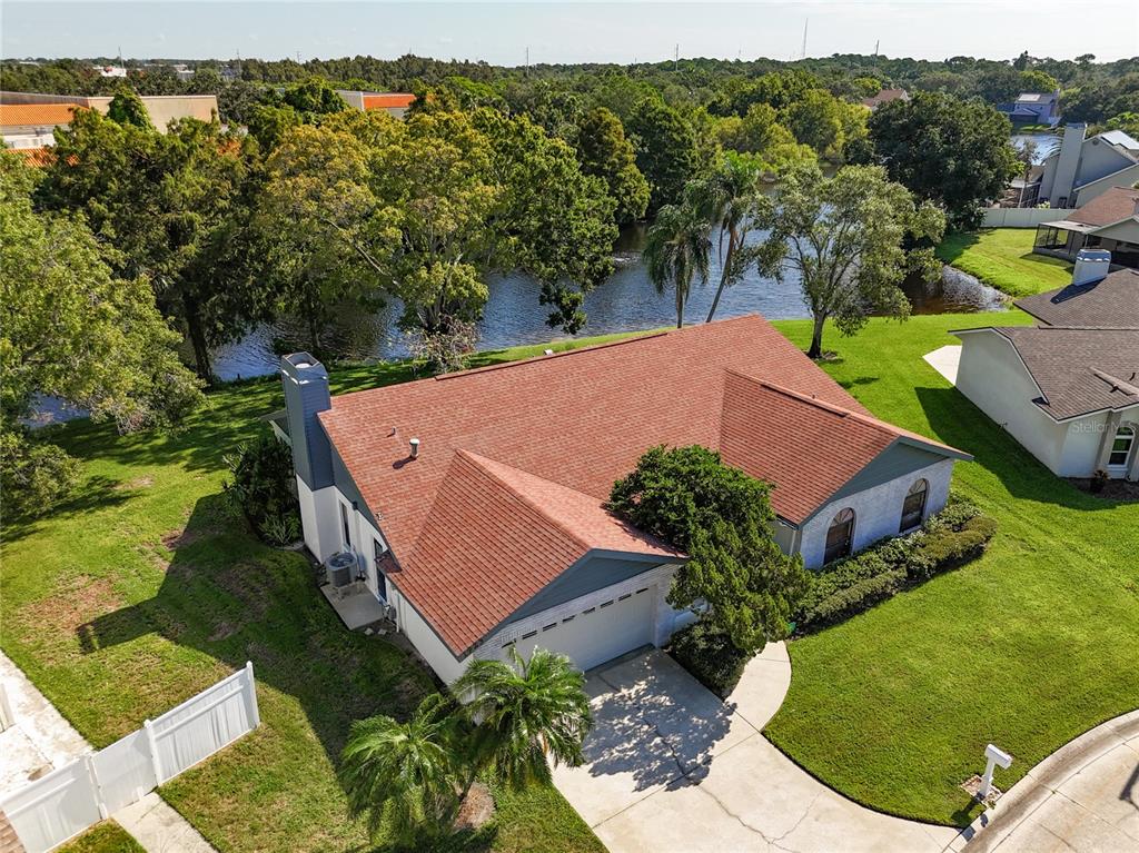 an aerial view of a house with a garden