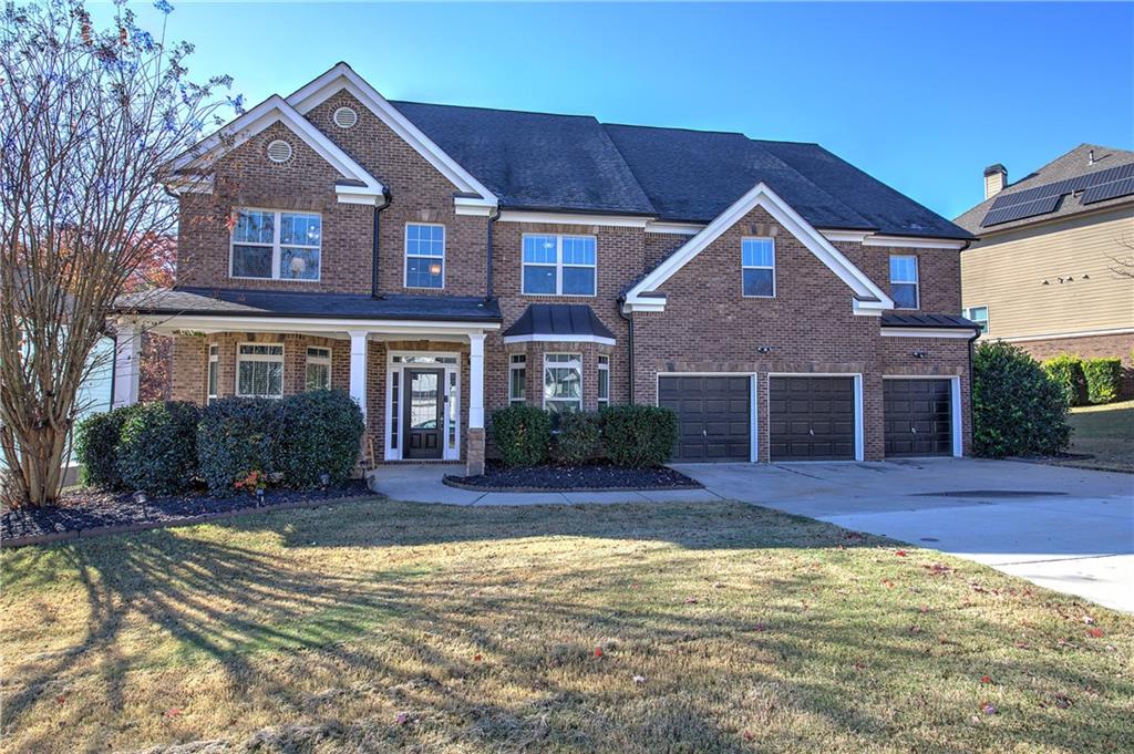 a front view of a house with a yard