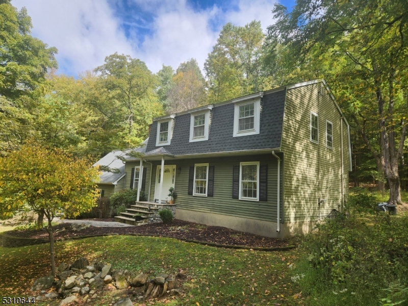 a view of a brick house with a yard