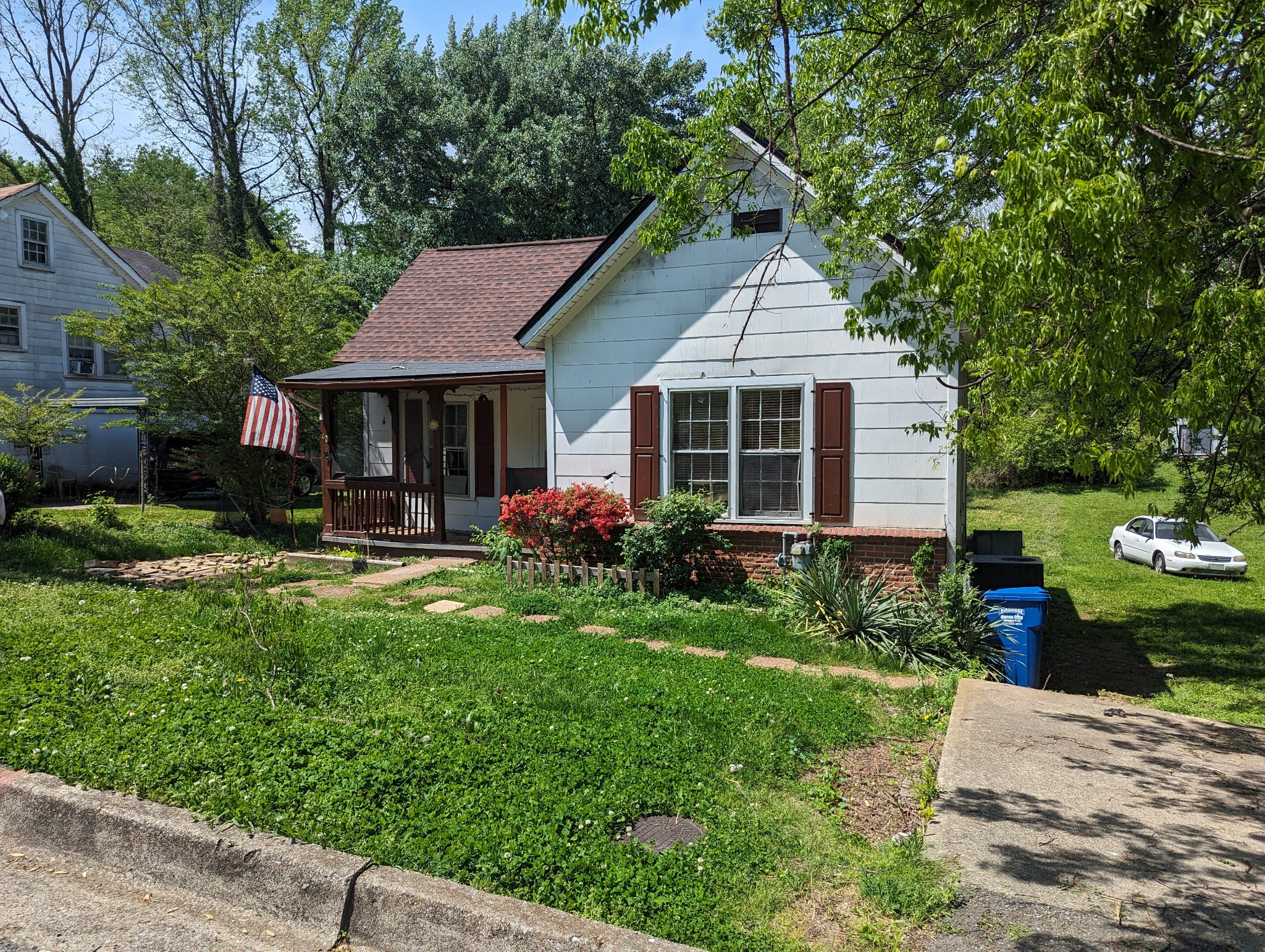 a front view of a house with garden