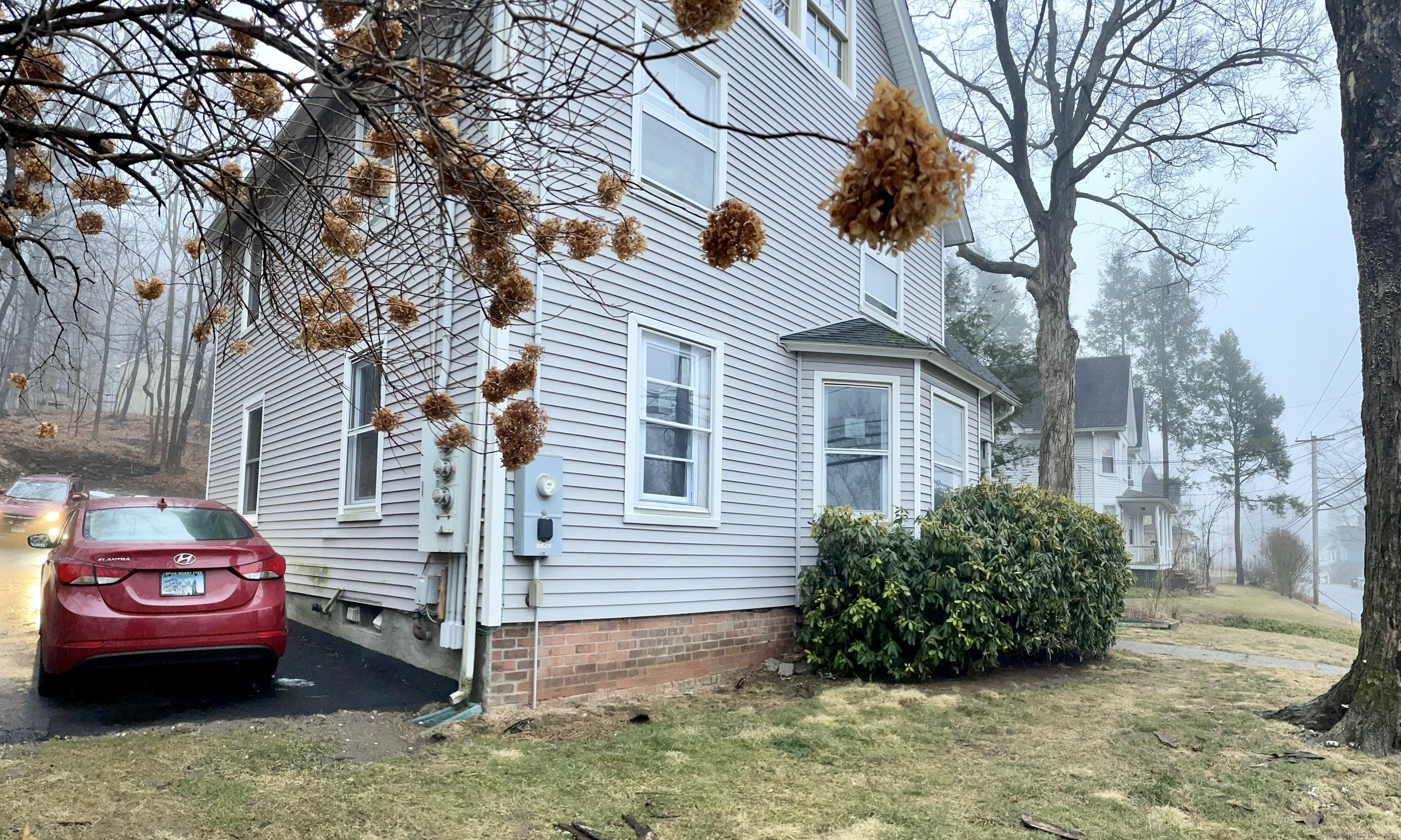 a view of a house with a back yard